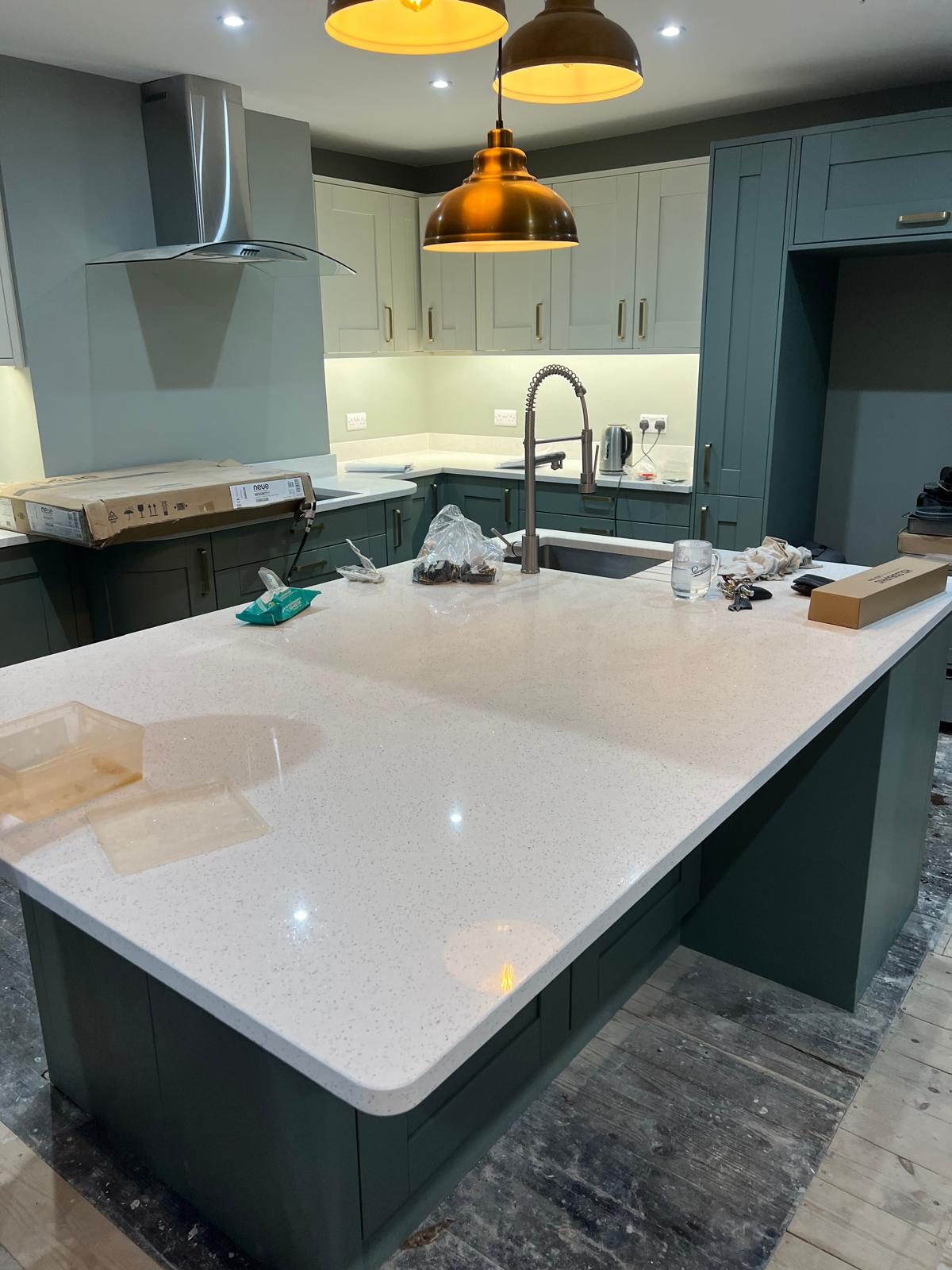Kitchen island with quartz worktop and undermount sink