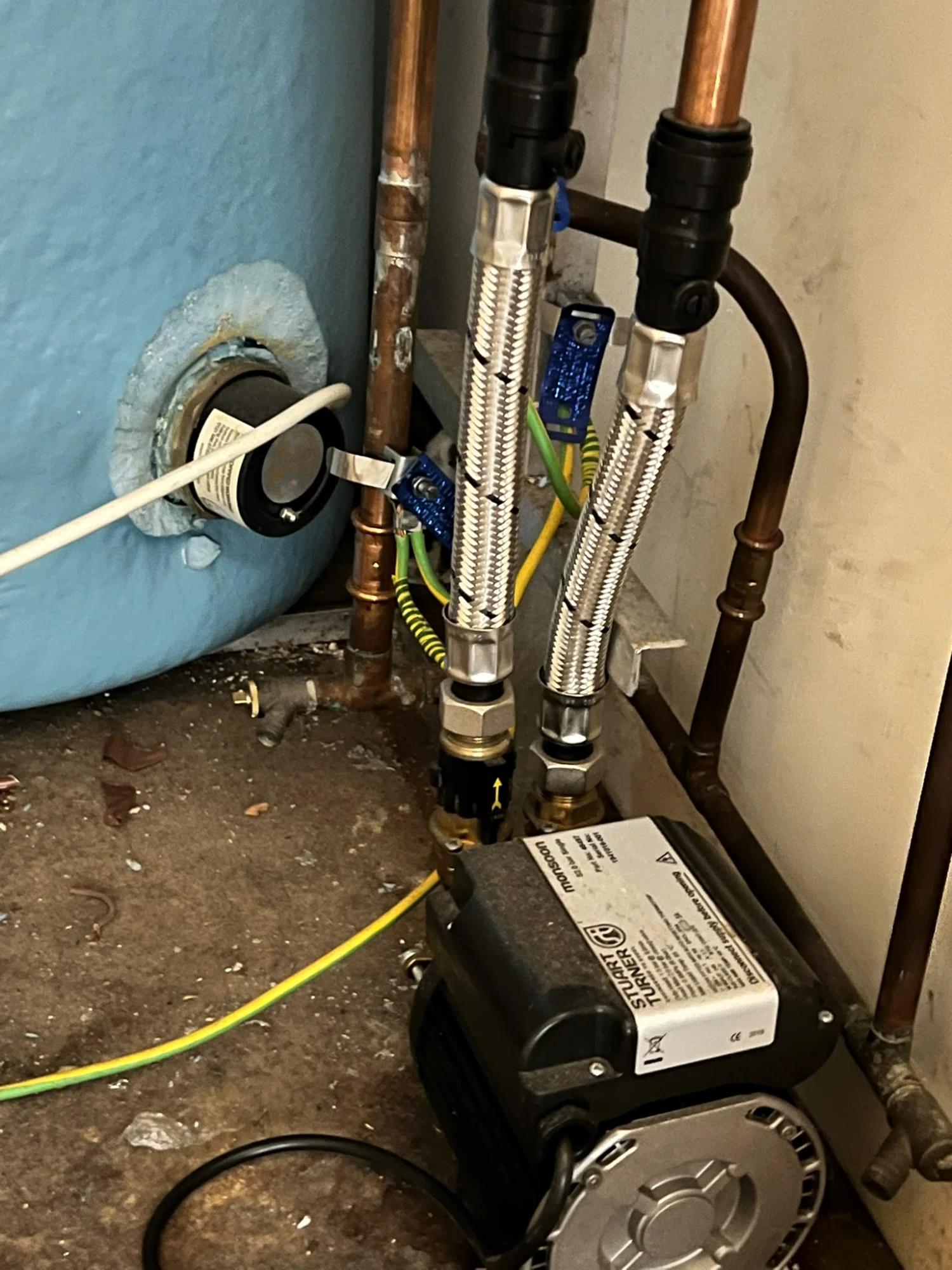 The old, leaking Stuart Turner shower pump before Graham replaced it