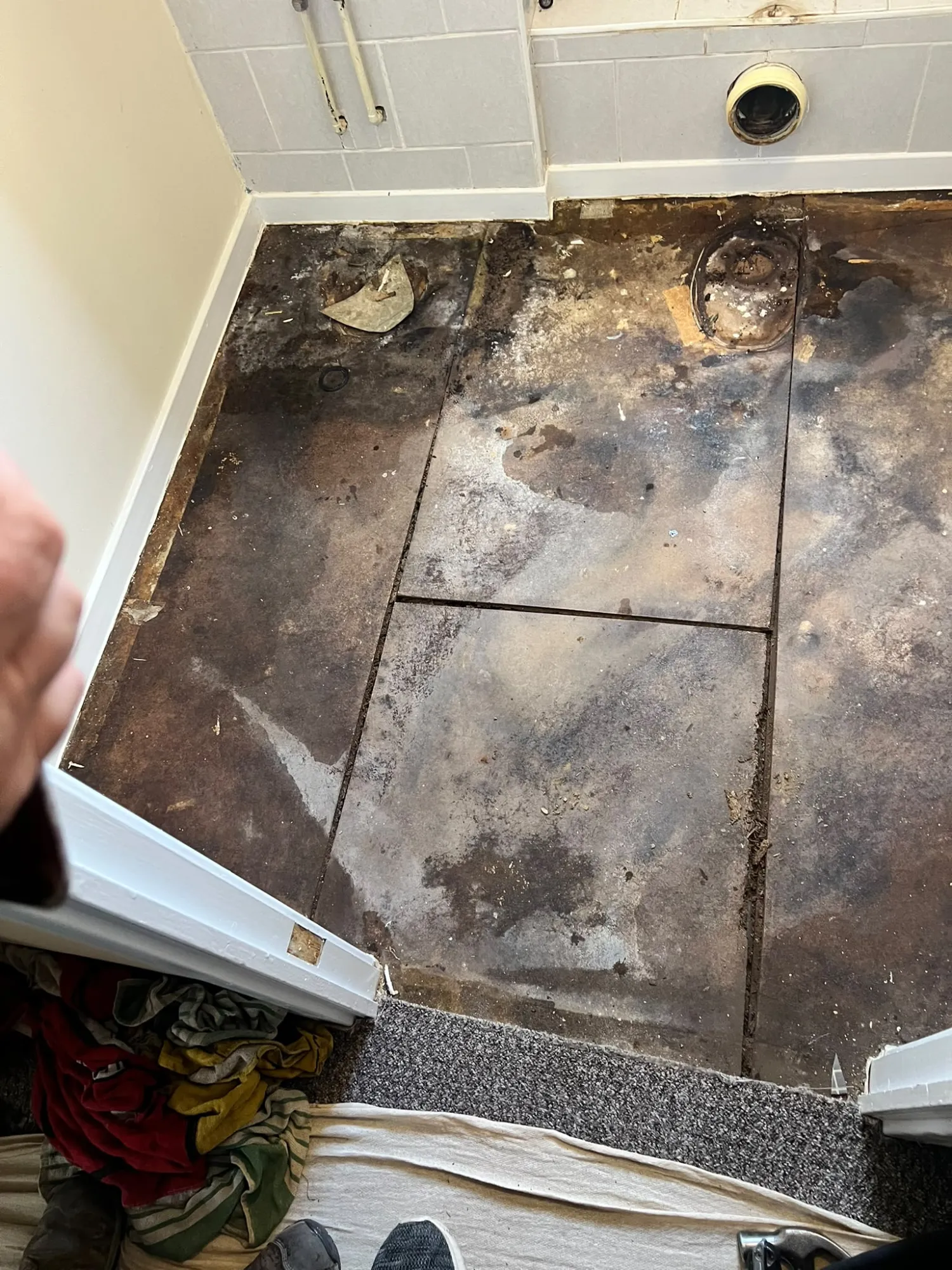 The rotten bathroom floor stripped back before the refit